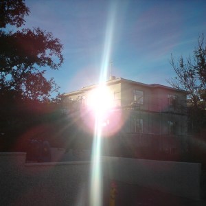 image: sunset reflected in window